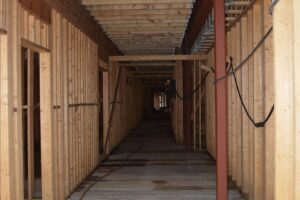 Corridor on first floor of residential units, looking east